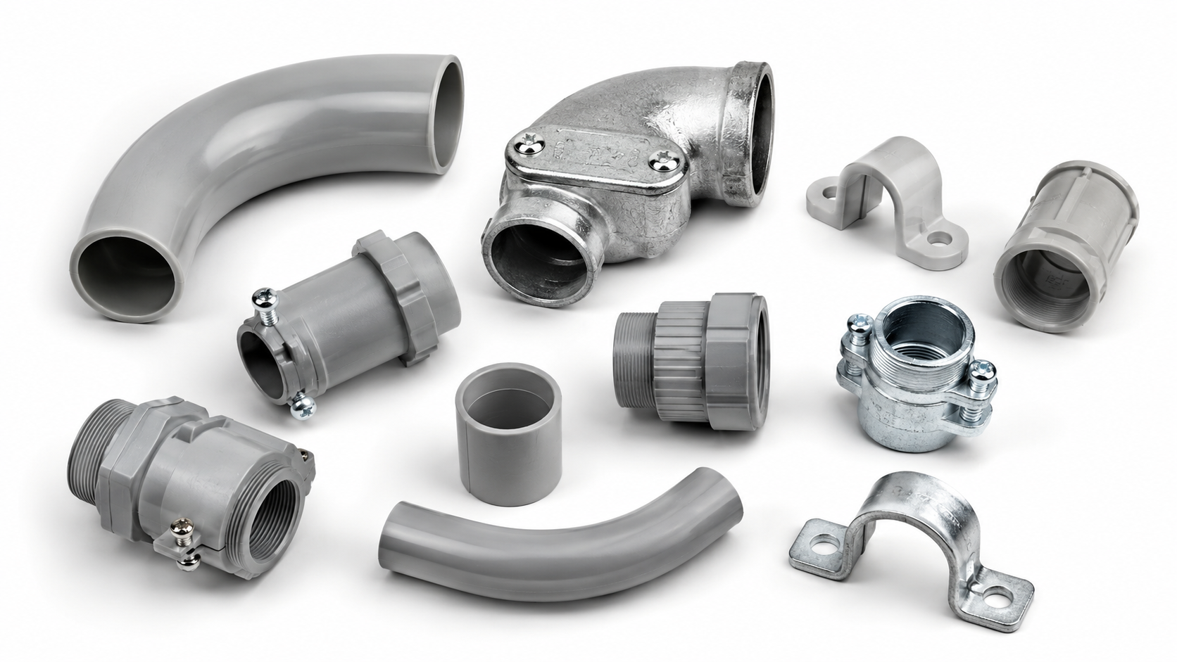 Assorted electrical conduit fittings including grey PVC sweep bend galvanised steel inspection elbow conduit saddle coupling and lock nut for Australian electrical installations