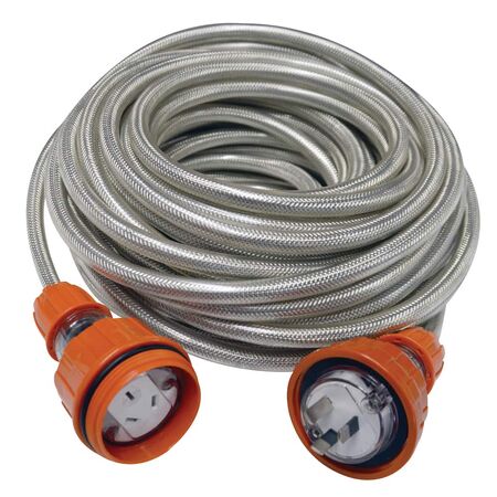 High-visibility IP66-rated outdoor extension lead coiled on a wet job site