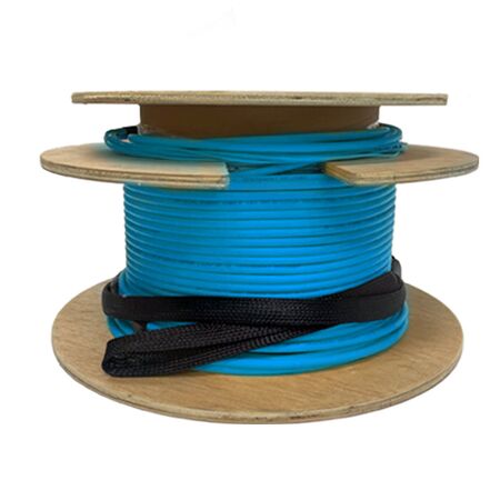Blue LC-LC pre-terminated fibre optic cable assembly coiled beside a network cabinet