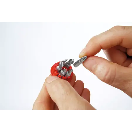 Screwdriver with bit magazine magnetic