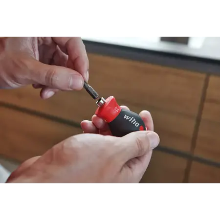 Screwdriver with bit magazine magnetic