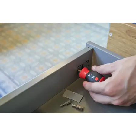 Screwdriver with bit magazine magnetic