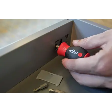 Screwdriver with bit magazine magnetic